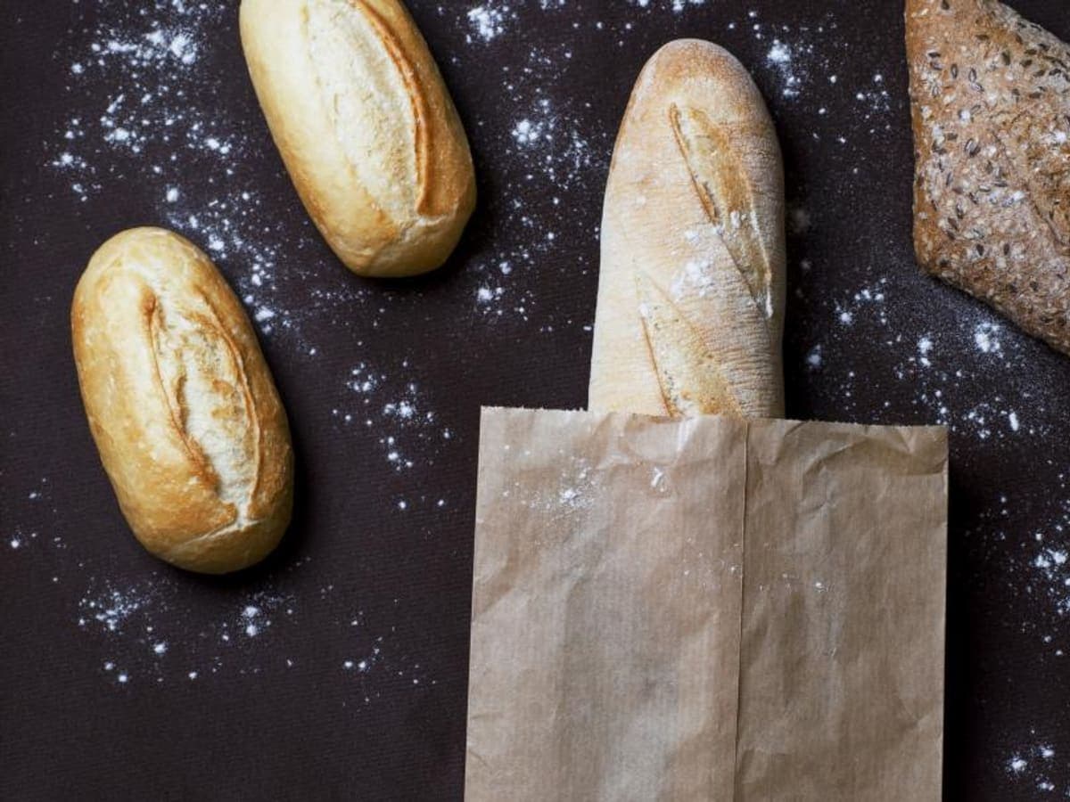 Fresh bread in a paper bag, seen from above.